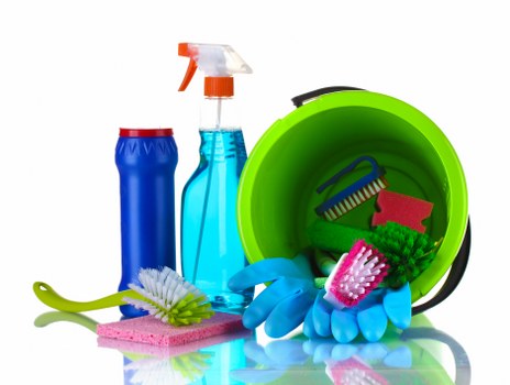 Carpet cleaning team preparing equipment with safety checks in a home setting