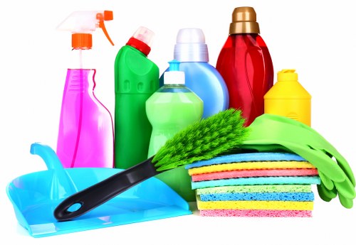 Professional carpet cleaner restoring a living room carpet in Grahame Park