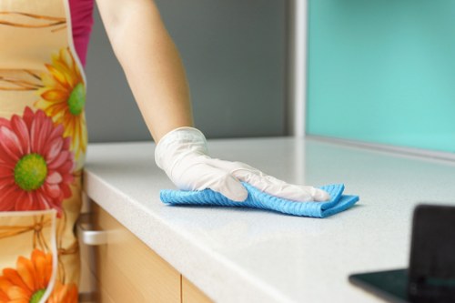 Professional carpet cleaners working safely with equipment and protective gear